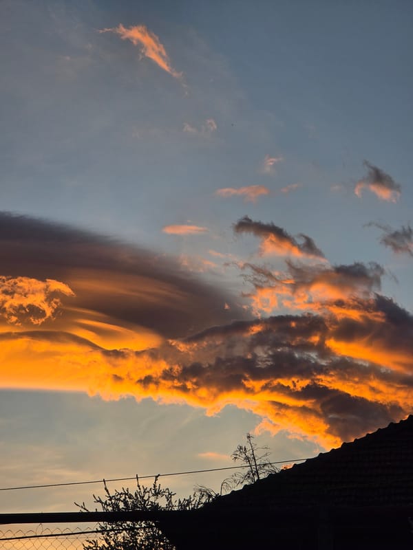 Dramatic lenticular cloud formation illuminates sunset over Berkovitsa, Bulgaria