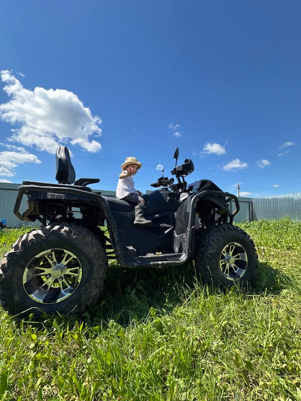 Family ATV ride and garden harvest in rural Russia
