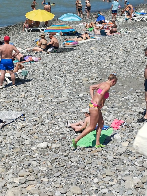 Busy summer morning on Sochi's Black Sea pebble beach