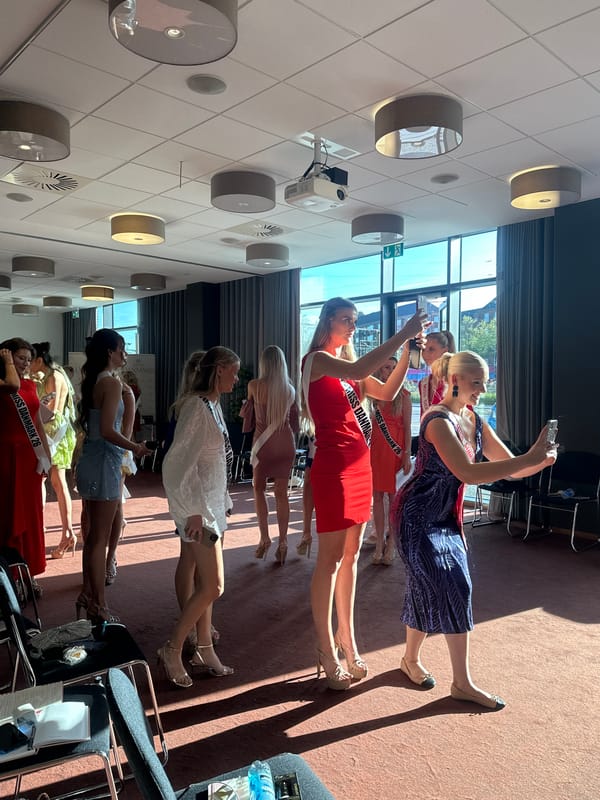 Beauty pageant contestants gather indoors in Copenhagen
