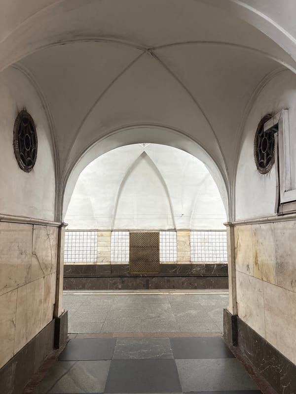 Inside an ornate metro system, escalators and all