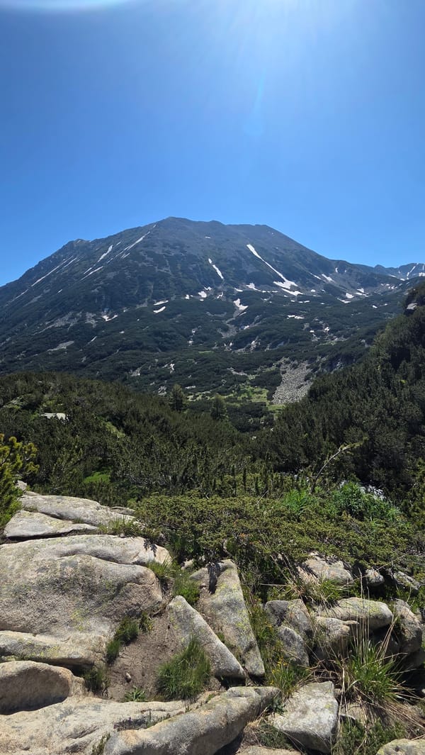 Summer morning hike to an alpine lake near Bansko
