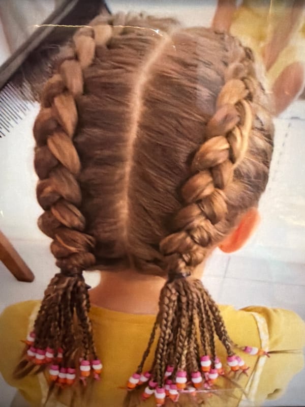 Hair braiding session with fish tank interaction in Kuta Selatan