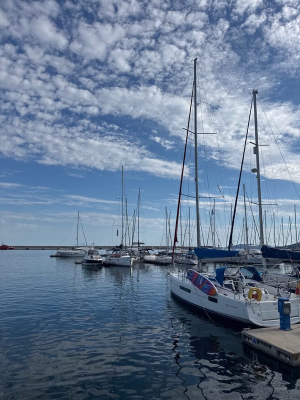 Sightseeing through a Greek coastal city's landmarks and harbor