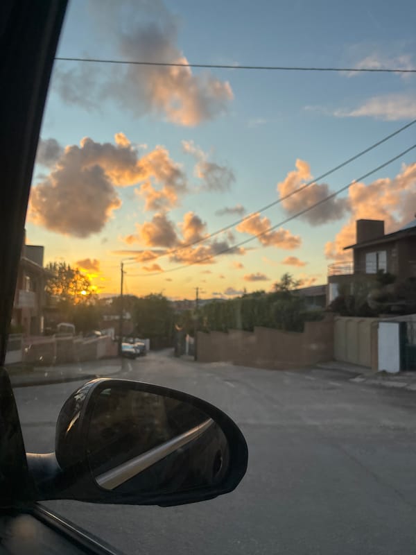 Sunset cityscape photographed from vehicle in Vila Nova de Gaia
