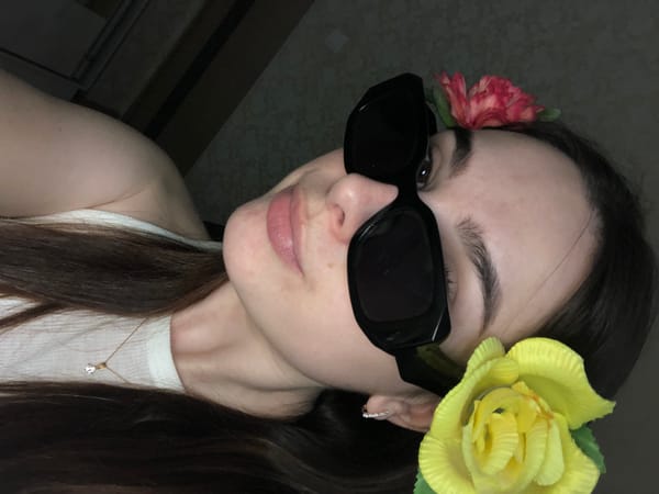 Woman in floral dress photographed in Noviy, Russia