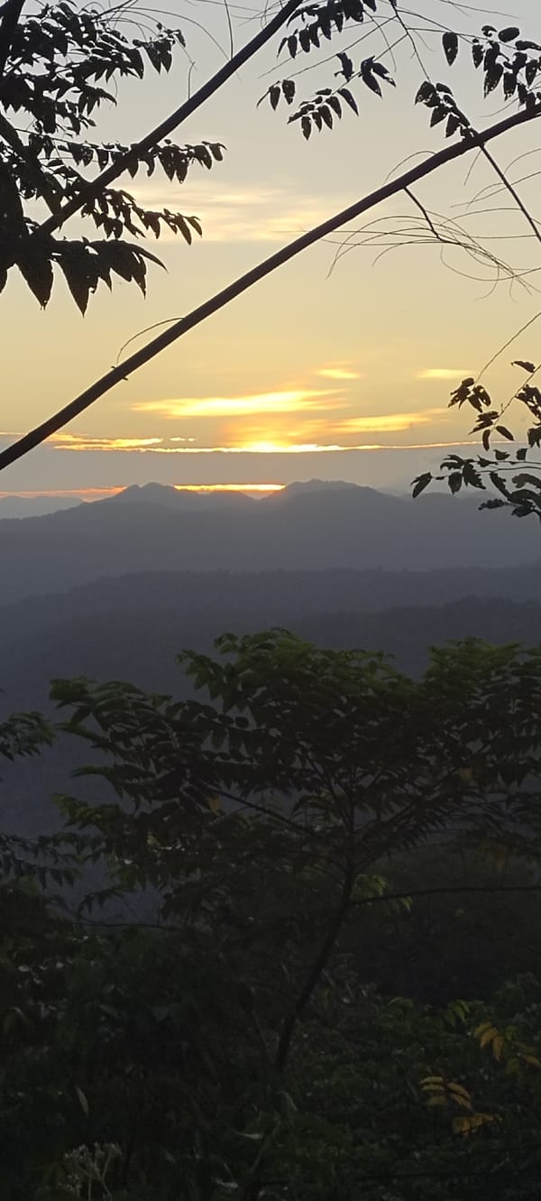Tourists visit Indonesian waterfall and mountain scenic overlook location