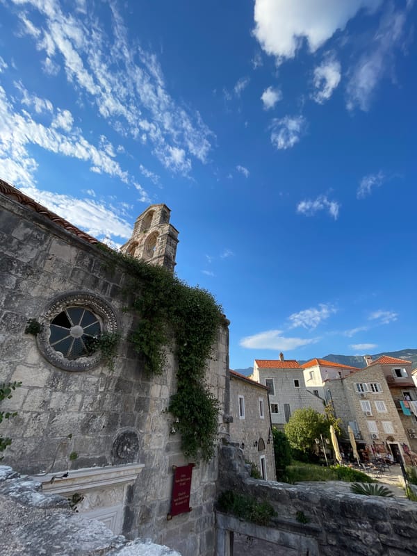 Historic stone church district documented with café scene