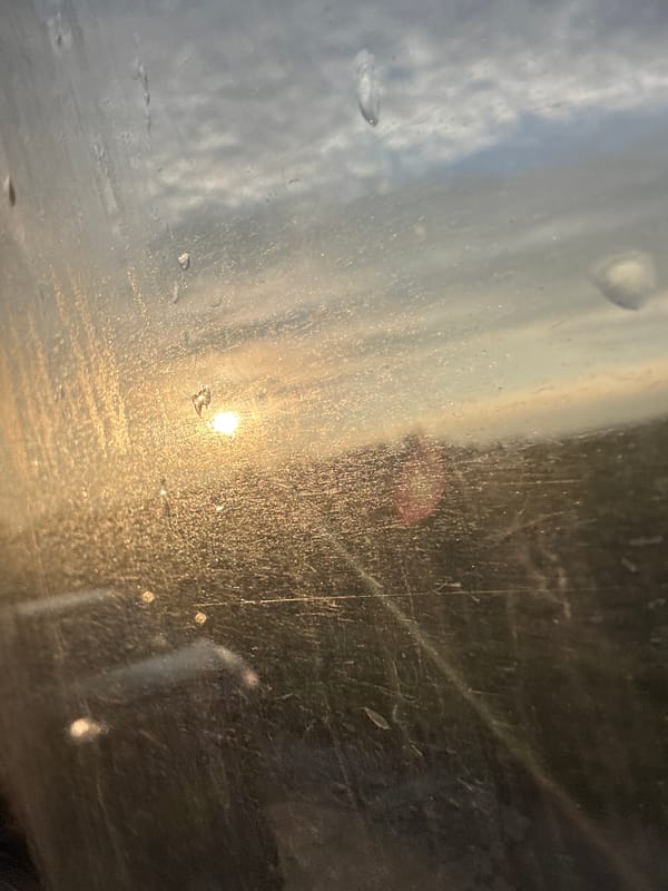Dawn view through dirty vehicle window in Bulgaria