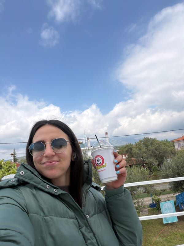 Woman enjoys coffee outdoors in Megas Alexandros, Greece