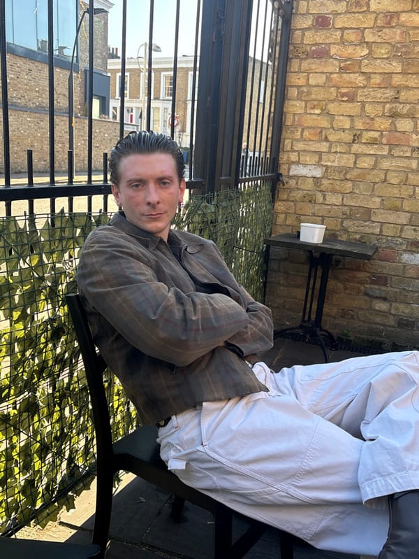 Friends gather at London pub garden on spring afternoon