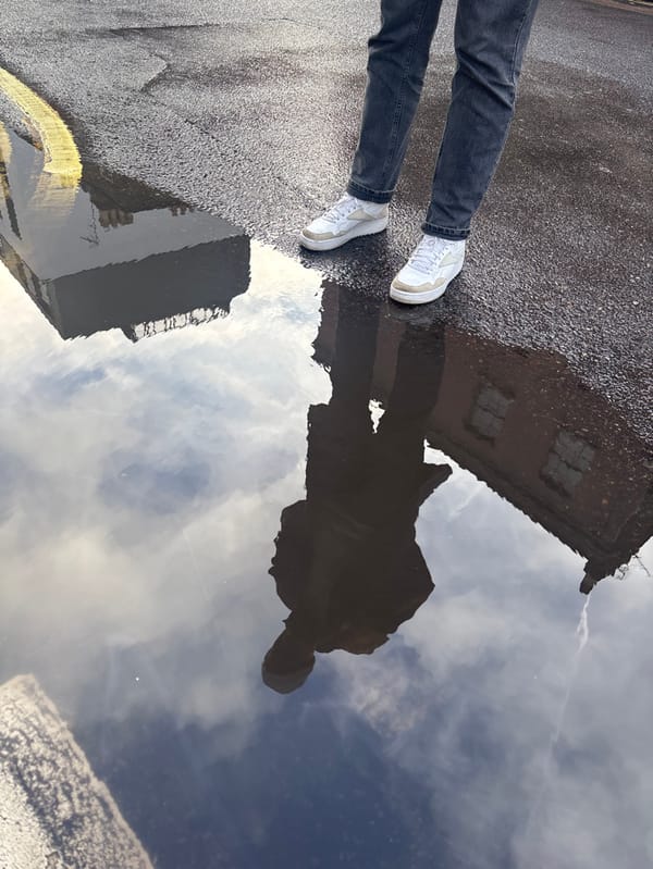 Person documents rainy London walk through Spitalfields district
