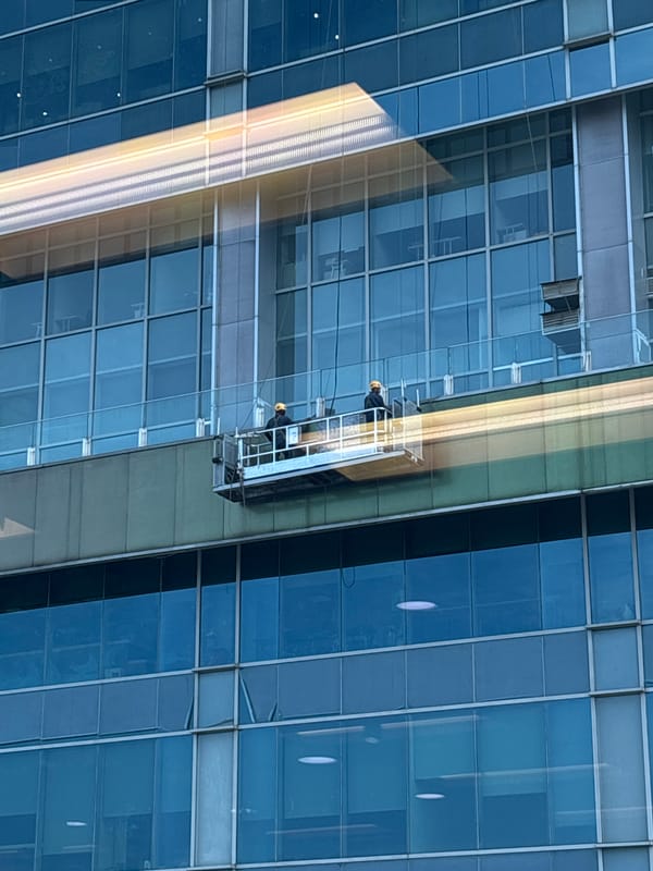 Window washers clean Jakarta high-rise in early morning hours