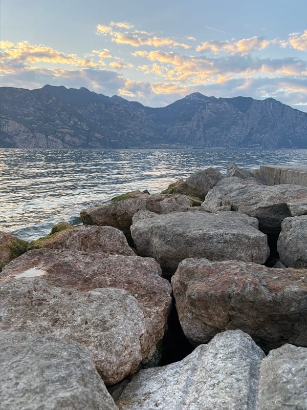 Lake Garda's rugged shoreline with mountain backdrop, Malcesine