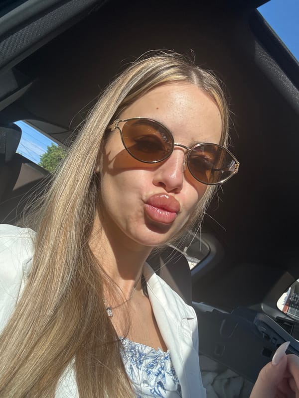 Woman takes morning car selfies in Ilindentsi, Bulgaria