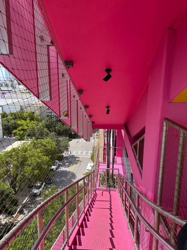 Colorful Miami storefronts and street-level architecture, mid-afternoon