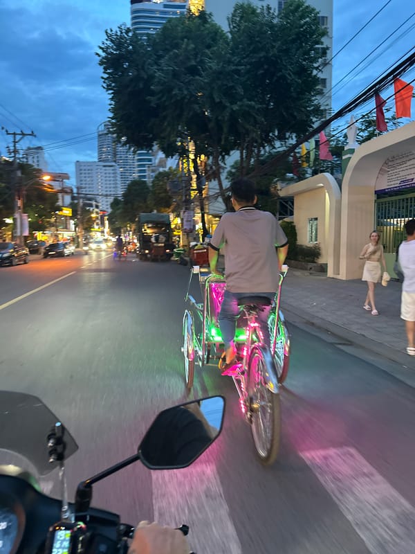 Scootering through Nha Trang at dusk, with a rooftop pool stop