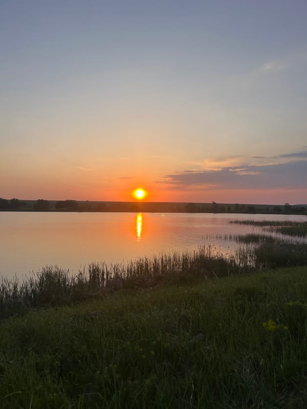 Sunset observed over water in Shuvalovka, Russia