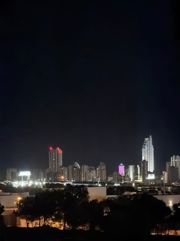 Finestrat's modern apartment skyline lit up at night