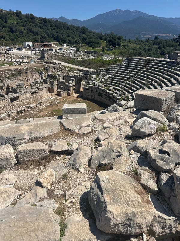 Tourist documents ancient Antiphellos ruins in Kaş, Turkey