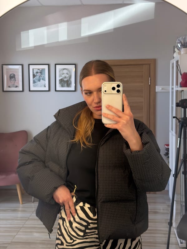 Woman documents zebra-striped outfit in Riga morning fashion shoot