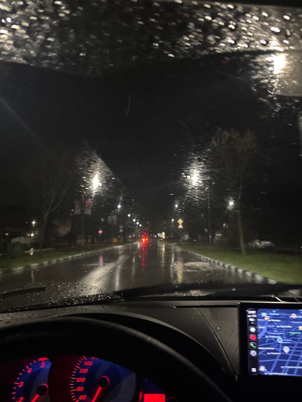 Evening drive through rainy Kazanlak captured from driver's perspective