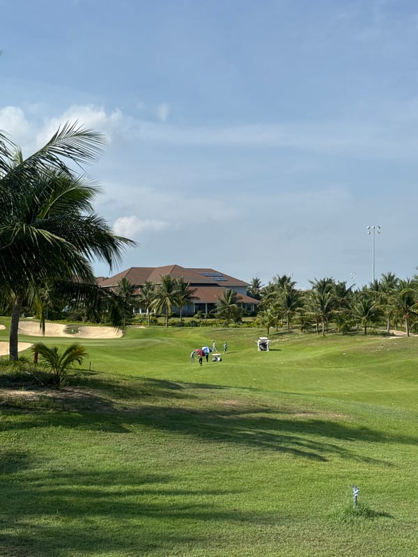 Golf round in progress at a tropical resort course, Phú Thủy