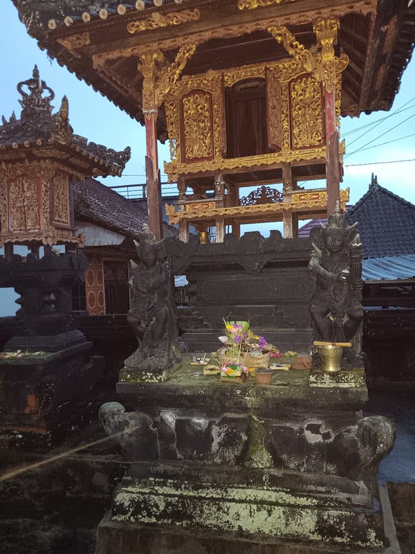 Morning observations capture Balinese architecture and baseball cap in Penebel