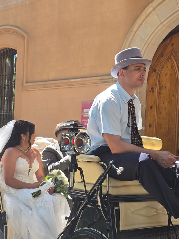 Horse-drawn carriage wedding arrival at a Cornellà de Llobregat venue