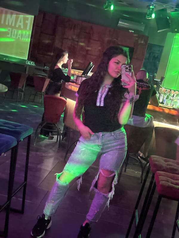 Woman takes evening selfies at Sliven nightclub
