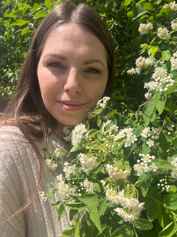 Woman documents spring day among blooming trees in Shevlyakovo