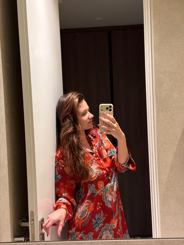 Woman takes bathroom mirror selfie in Athens