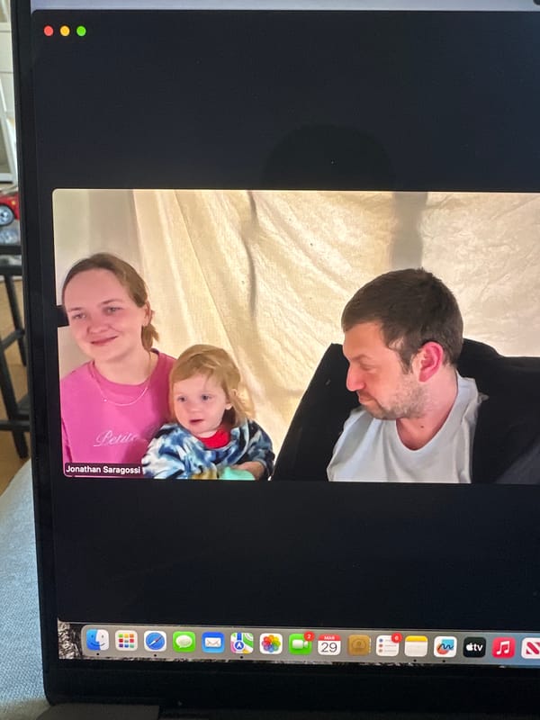 Family video call captured on computer screen in Milan