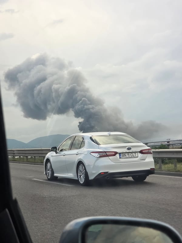 Dark smoke rises near highway outside Voluyak, Bulgaria