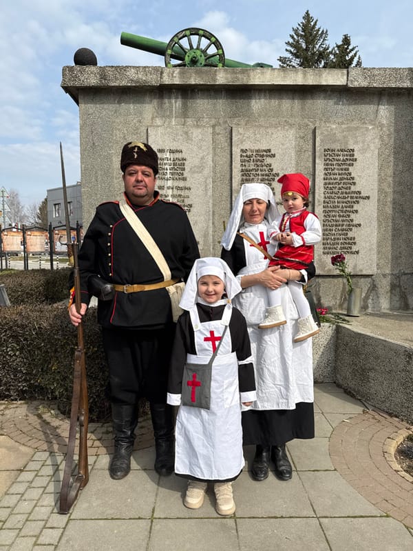Visitors pose at Slivnitsa war memorial in Bulgaria