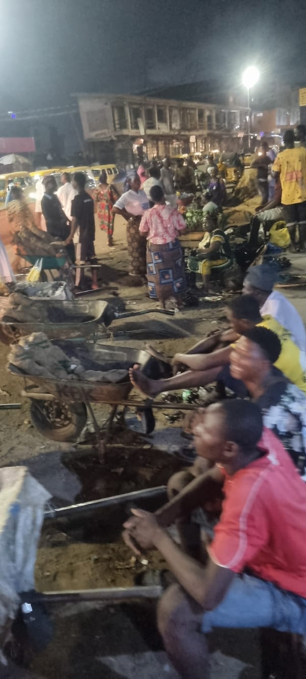 Evening street scenes observed in Lagos include vehicle incident, clothing vendors