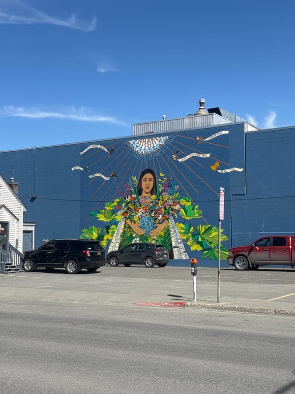 Mural featuring woman with flowers documented in Anchorage