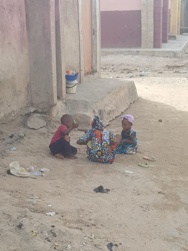 Children gather on street in Dutsinma B, Nigeria