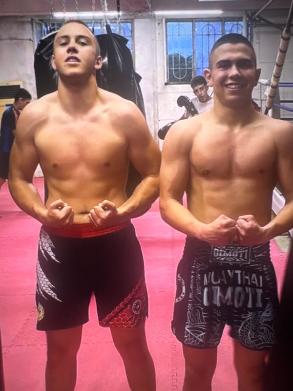Two men pose flexing for photo in Varna