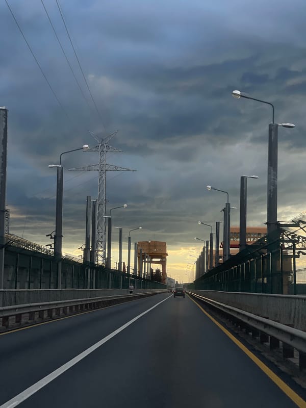 Stormy highway drive with Orthodox church and a Russian quote