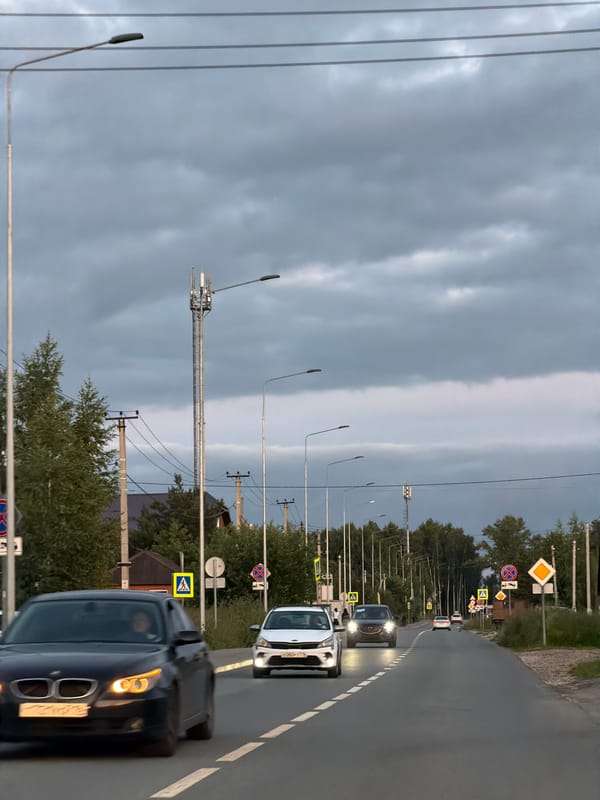 Overcast afternoon traffic on a suburban Kazan roadway