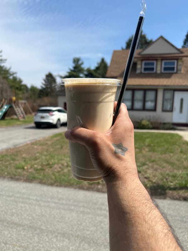 Person enjoys iced coffee in New Windsor