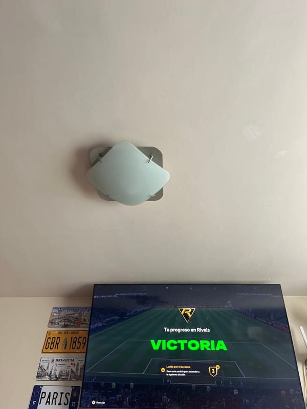 Indoor scene with TV showing soccer game in Puebla