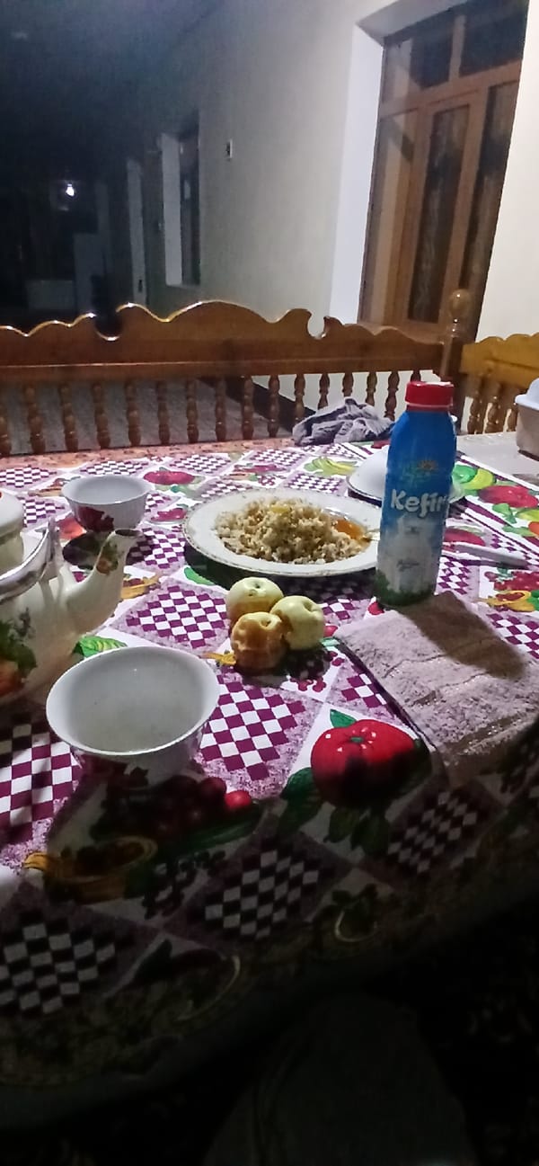 Relaxed mealtime at a home table in Andijani, Uzbekistan