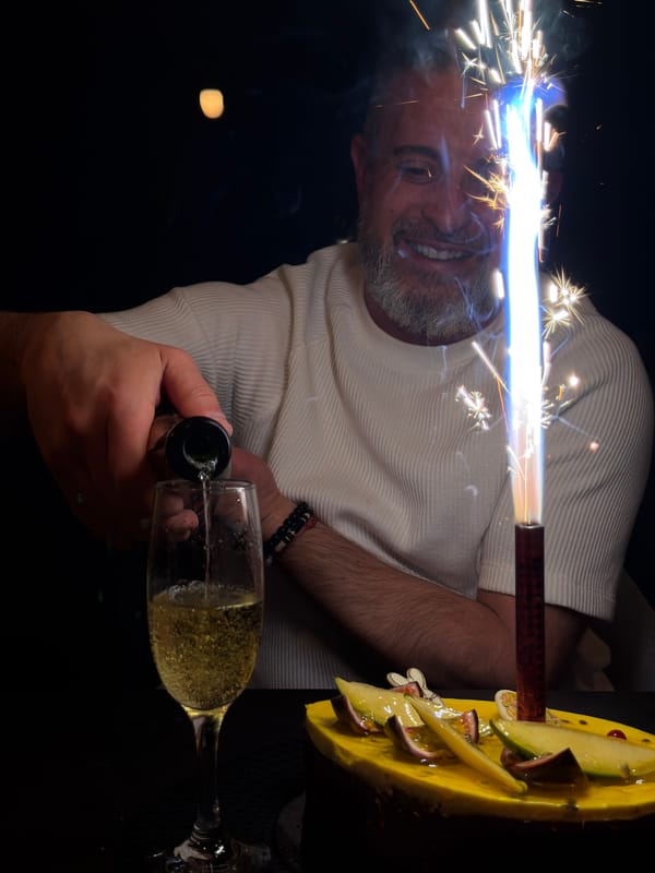 Birthday celebration with champagne and cake in Junglinster