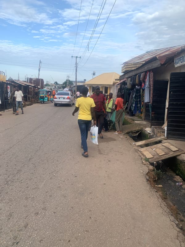 Street life and commerce moving through central Jos, Nigeria
