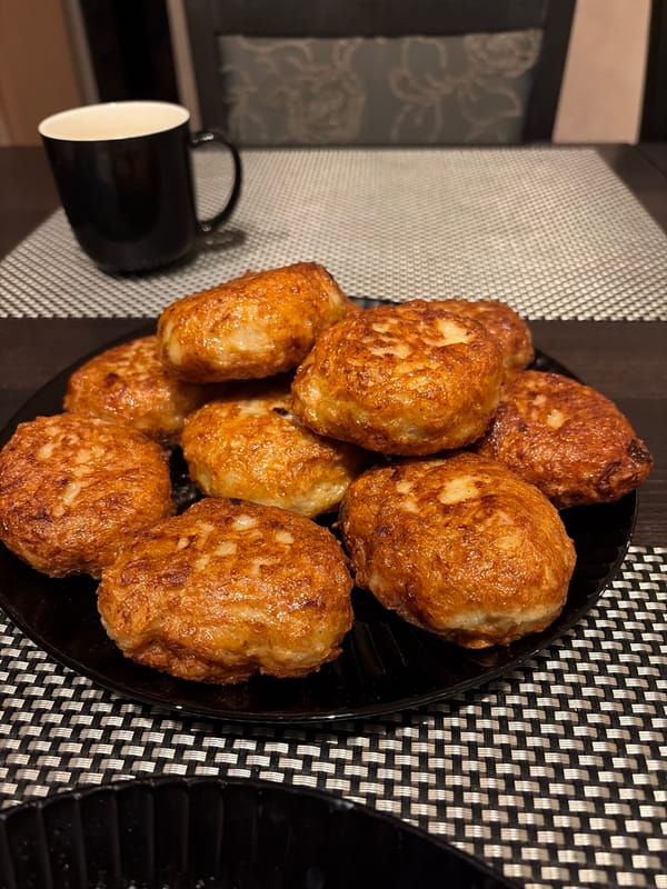 Peacock displays colorful plumage near pond in Budva