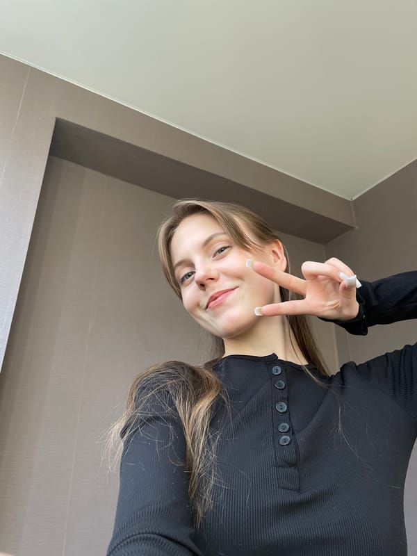 Young woman takes selfies indoors in Ufa, Russia