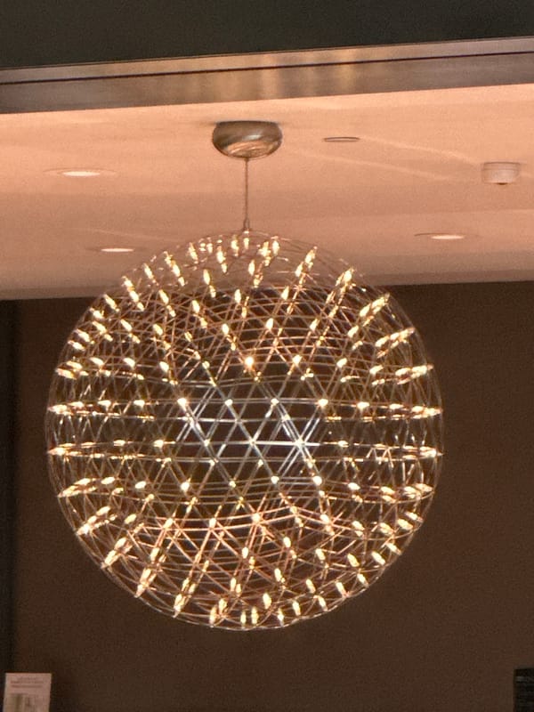 Geometric spherical chandelier documented in Burnaby indoor space