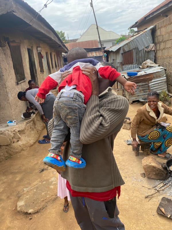Family gathering documented in Jos, Nigeria morning scene
